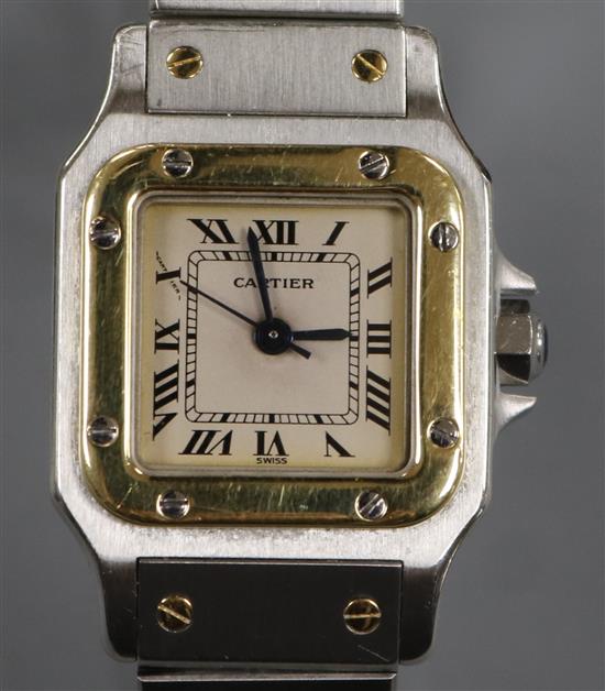 A ladys stainless steel and yellow metal Santos De Cartier automatic wrist watch, no box or paperwork.